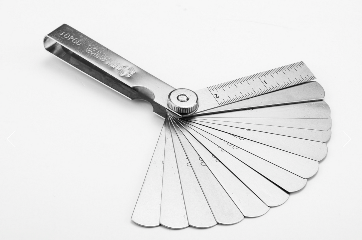 Shop the SATA 09401 14-Piece Feeler Gauge Set 0.05-1.00mm: Mn steel blades, polished finish, includes ruler. Precise gap measurement for mechanics.