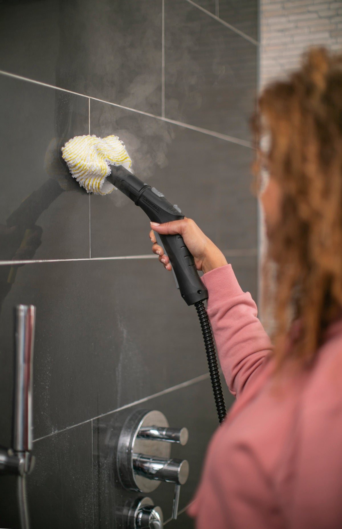 Karcher steam cleaner SC 2 Deluxe cleaning a toilet wall